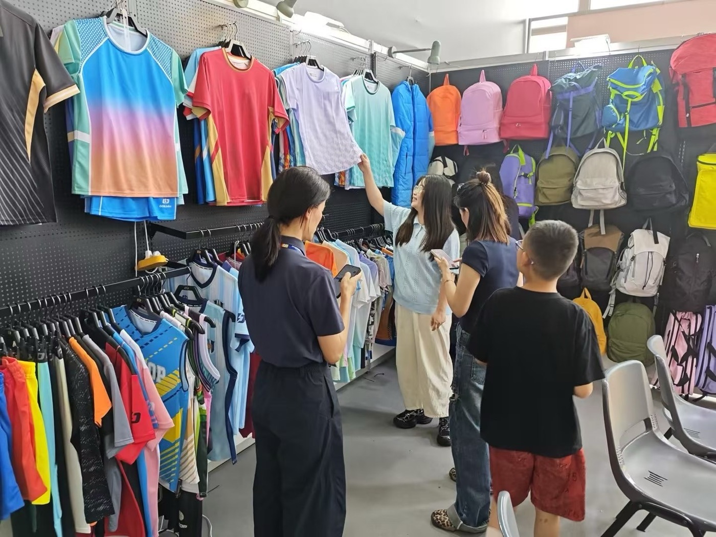 Buyers working through the sportswear and bag range